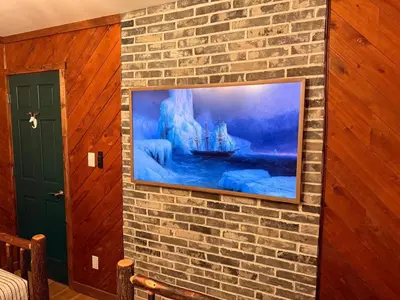 a painting of a boat on a brick wall at Secluded, Luxuriously Remodeled, Gaming, Hot Tub! in South Bloomingville