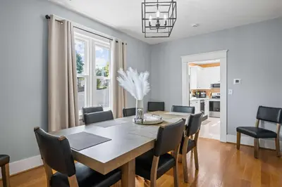 a dining room with a table and chairs at Double Game Rooms! - 4BR Only 7 Min to Ark in Williamstown
