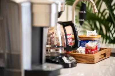 a kitchen counter with a blender and a box of food at Double Game Rooms! - 4BR Only 7 Min to Ark in Williamstown