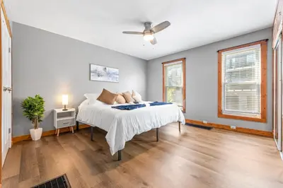 a bedroom with a bed and a ceiling fan at Main Floor Tremont Home with KING Bed, Mins From DT, Pet Friendly in Cleveland