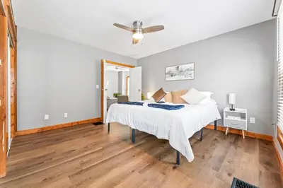 a bedroom with a bed and a ceiling fan at Main Floor Tremont Home with KING Bed, Mins From DT, Pet Friendly in Cleveland
