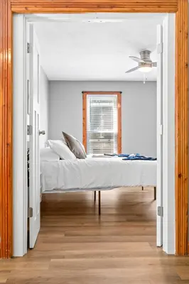 a bedroom with two beds and a window at Main Floor Tremont Home with KING Bed, Mins From DT, Pet Friendly in Cleveland