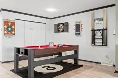 a billiard room with a pool table in it at Luxe Suite with Pool Table, King Bed, 3 TVs, & Free Parking in Cleveland