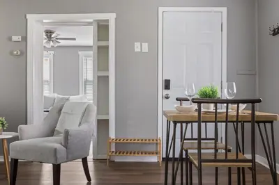 a dining room with a chair and a table at KING Bed Entire House Near DT in Cleveland