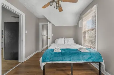 a bedroom with a bed and a ceiling fan at Luxe Mattresses Pet Friendly Free Prkng WiFi in Cleveland