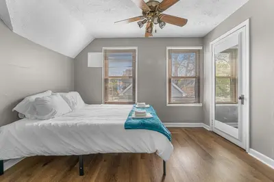 a bedroom with a bed and a ceiling fan at Luxe Mattresses Pet Friendly Free Prkng WiFi in Cleveland