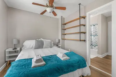 a bedroom with a bed and a ceiling fan at Luxe Mattresses Pet Friendly Free Prkng WiFi in Cleveland