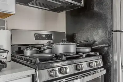 a kitchen with a stove with pots and pans at Luxe Mattresses Pet Friendly Free Prkng WiFi in Cleveland