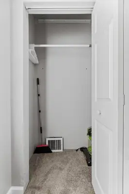 a room with a white closet with a door at Little Italy Family Suite 4 TVs Bunk Beds in Cleveland