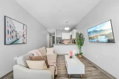 a living room with a couch and a table at DT Pet Friendly Parking Gym Wifi Coffee in Cleveland