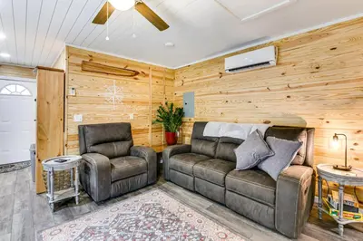 a living room with a couch and two chairs at Cottage Close to Caves and Trails in Hocking Hills! in Logan