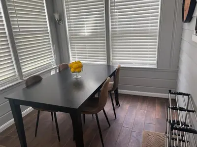 a dining room table with chairs and a bowl of fruit at Westdale in Cleveland