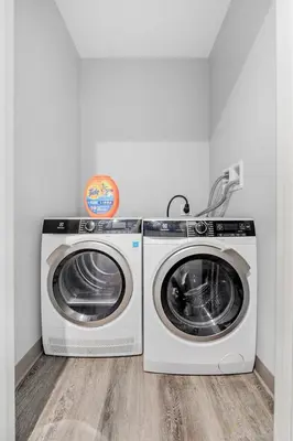 two washing machines sitting next to each other in a room at DT Fast Wifi Pet Friendly Bidet Sprayer in Cleveland