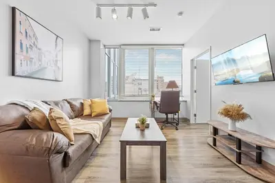 a living room with a couch and a table at DT Fast Wifi Pet Friendly Bidet Sprayer in Cleveland