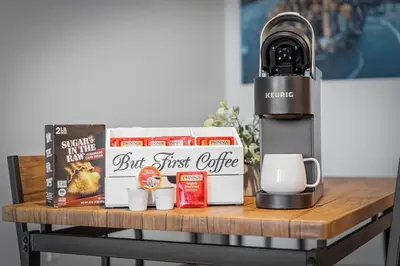 a coffee machine sitting on top of a table with food at DT Gym Pet Friendly 1 Bus to Clinic or CSU in Cleveland
