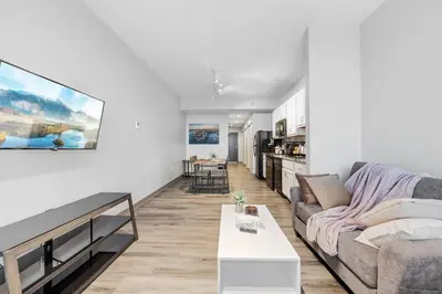 a living room with a couch and a table at DT Gym Pet Friendly 1 Bus to Clinic or CSU in Cleveland