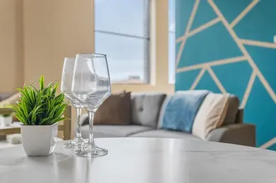 two wine glasses sitting on top of a table at Downtown Gym Sauna Parking Pet Friendly in Cleveland