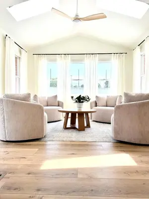 a living room with two couches and a table at Country Comfort with Pool Family & Groups in Dundee