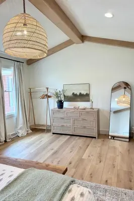 a bedroom with a dresser and a mirror in a room at Country Comfort with Pool Family & Groups in Dundee