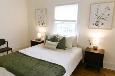 a bedroom with a large bed and a window at 