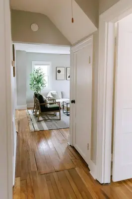 a hallway with a door open to a living room at 