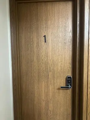 a wooden door with a lock on it at quiet and comfortable in Cleveland