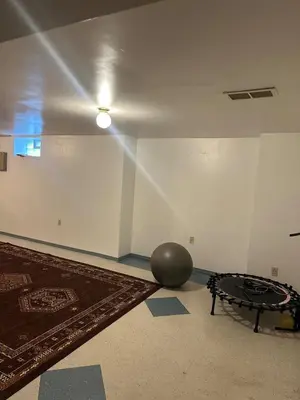 a room with a ball and a table on the floor at quiet and comfortable in Cleveland