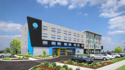 a rendering of a building with cars parked outside at Tru By Hilton Middleburg Heights Cleveland Airport in Middleburg Heights