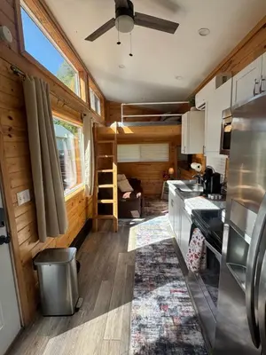 a kitchen in a tiny house at Creekside Haven Tiny Home