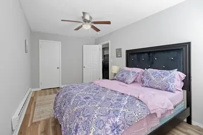 a bedroom with a bed and a ceiling fan at Luxury room in Cincinnati in Cincinnati