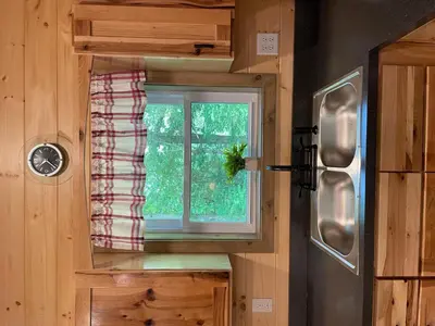 a view of a window in a tiny house at Hillside Haven in Warsaw