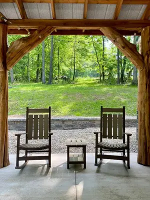 two chairs and a coffee table in a pavilion at Hillside Haven in Warsaw