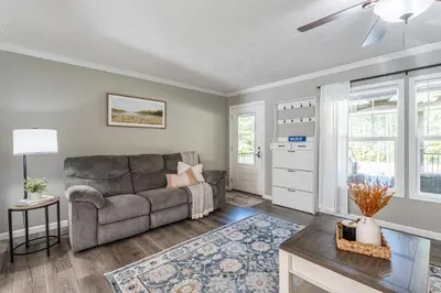 a living room with a couch and a table at Wildcat Lodge, Wallingford KY in Wallingford