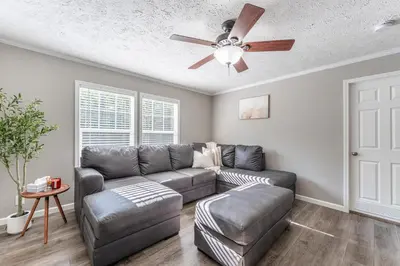 a living room with a couch and a ceiling fan at Wildcat Lodge, Wallingford KY in Wallingford