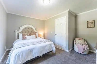a bedroom with a large bed and a door at Wildcat Lodge, Wallingford KY in Wallingford