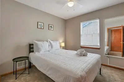 a bedroom with a bed with a teddy bear on it at Quiet Ranch Retreat for Work Crews & Families Johnstown OH