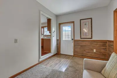 a living room with a couch and a window at Quiet Ranch Retreat for Work Crews & Families Johnstown OH