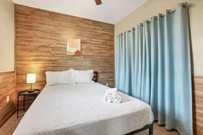 a bedroom with a bed with two towels on it at Quiet Ranch Retreat for Work Crews & Families Johnstown OH
