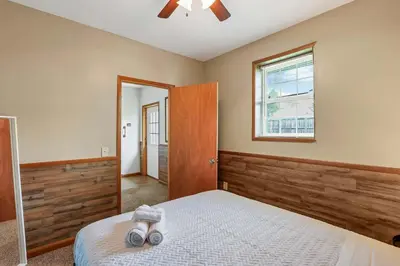 a bedroom with a bed and a ceiling fan at Quiet Ranch Retreat for Work Crews & Families Johnstown OH