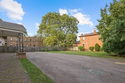 an empty street in front of a house at Spacious Historic 8-Bedroom Manor in Short North - Perfect for Large Groups in Columbus