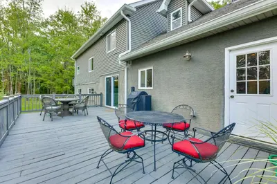 a patio with a table and chairs on a deck at Large Yard with Pond Family Retreat in New Albany! in New Albany