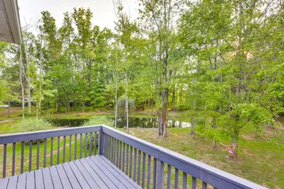 a balcony with a view of a park at Large Yard with Pond Family Retreat in New Albany! in New Albany