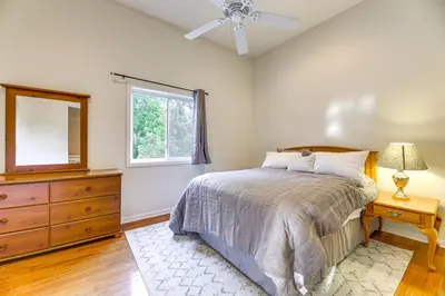 a bedroom with a bed and a dresser and a window at Large Yard with Pond Family Retreat in New Albany! in New Albany