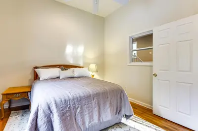 a bedroom with a bed and a white door at Large Yard with Pond Family Retreat in New Albany! in New Albany