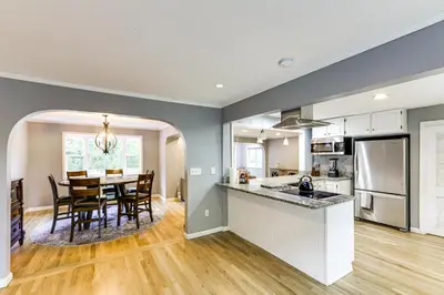 a kitchen and dining room with a table and chairs at Large Yard with Pond Family Retreat in New Albany! in New Albany