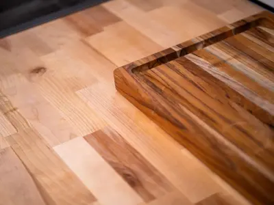 a wooden table sitting on top of a wooden floor at Unique BOHO Ohio City Loft Apt in Cleveland