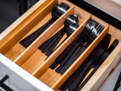 a wooden drawer with cutlery in it at Unique BOHO Ohio City Loft Apt in Cleveland