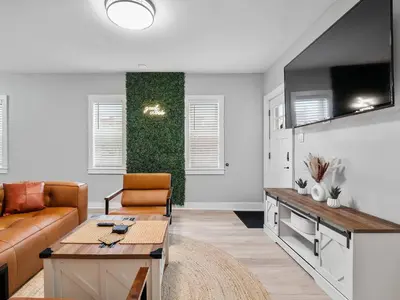 a living room with a couch and a table at Amazing Boho Oasis Apartment in Ohio City in Cleveland