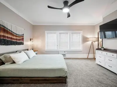 a bedroom with a bed and a ceiling fan at Amazing Boho Oasis Apartment in Ohio City in Cleveland
