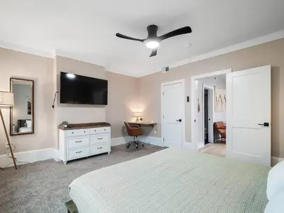 a bedroom with a bed and a ceiling fan at Amazing Boho Oasis Apartment in Ohio City in Cleveland